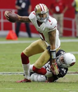 Kaep gets dragged down at the end of his ridiculous 2-yard scramble